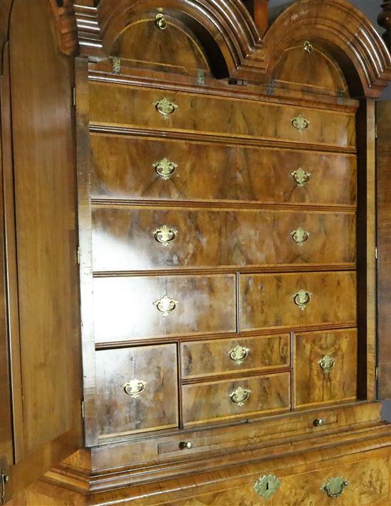 An early 18th century walnut double dome top secretaire cabinet, W.3ft 7in. D.1ft 10in. H.7ft 1in.